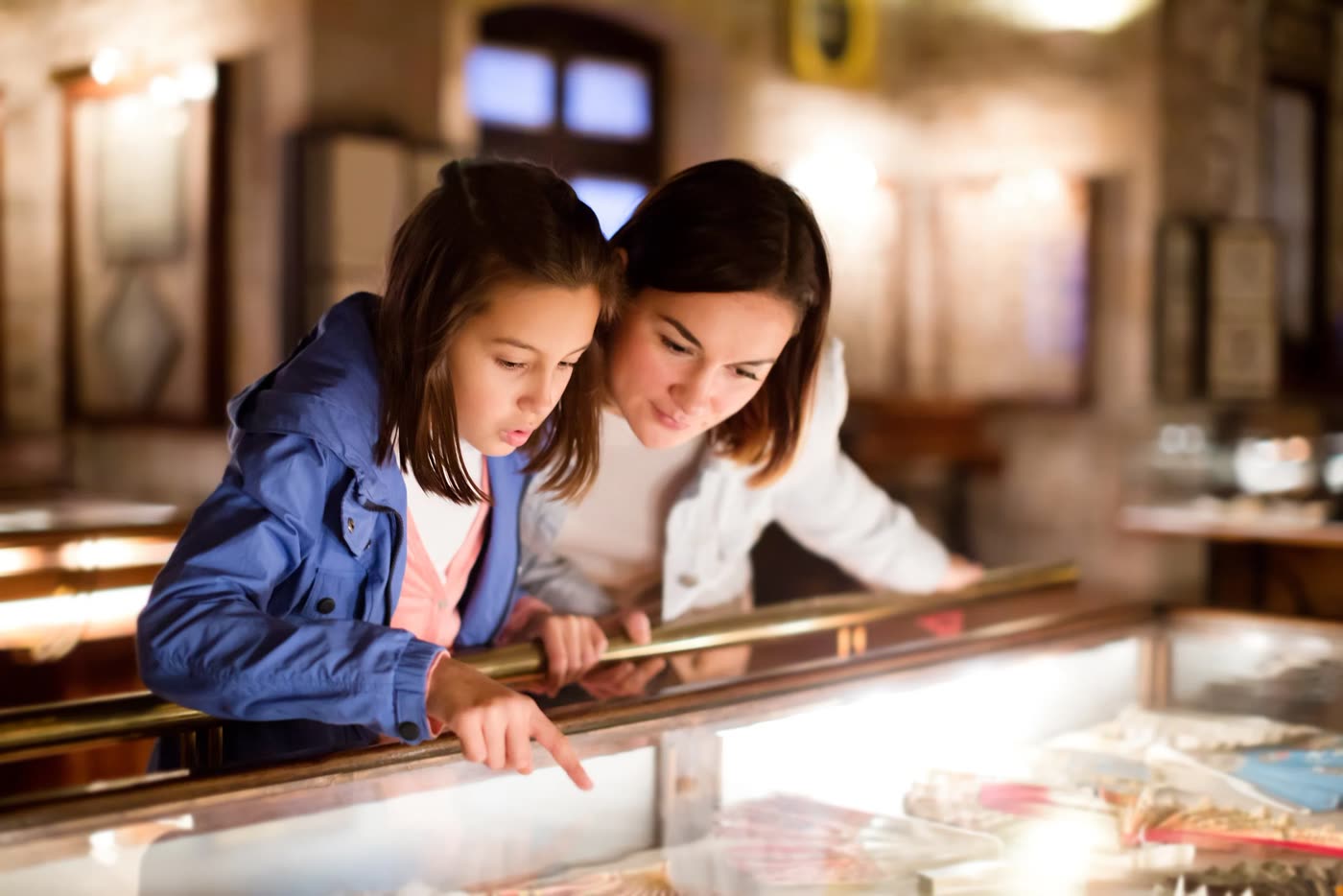 Visitors exploring museum exhibits